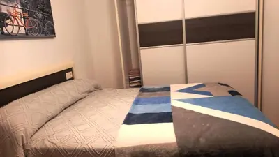 a small bedroom with a bed and a closet at EnFOZ PLAYA DE LLAS in Foz