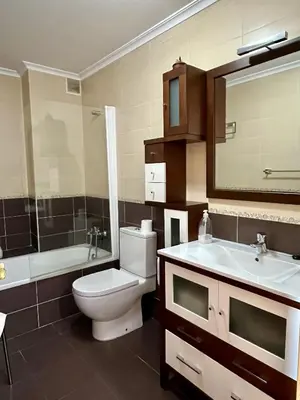 a bathroom with a toilet and a sink and a mirror at Preciosas vistas en el corazón de la Riveira Sacra in Quiroga