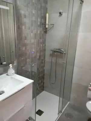 a bathroom with a shower and a sink at Casa rural La Barriada de Lago de Carucedo in Lago de Carucedo