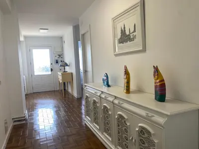 a living room with a table with vases on it at Magnífica casa independiente by beBalmy in Santiago de Compostela