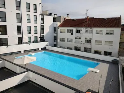 a swimming pool on the roof of a building at Apartamento en Sada con Piscina in Sada