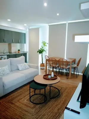 a living room with a couch and a table at Apartamento en Sada con Piscina in Sada