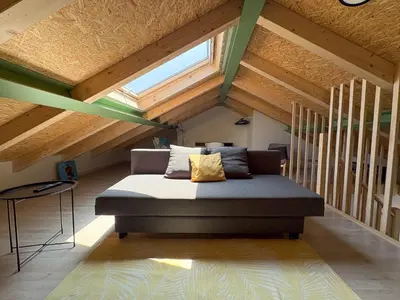 a bedroom with a bed in a attic at Apartamentos Ribadeo in Ribadeo