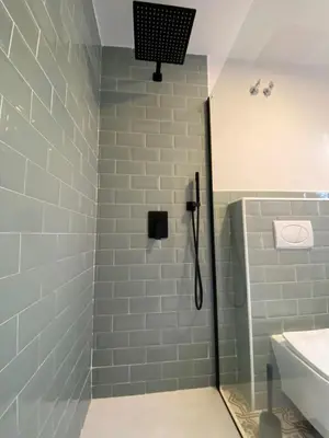 a bathroom with a shower and a sink at Apartamentos Ribadeo in Ribadeo