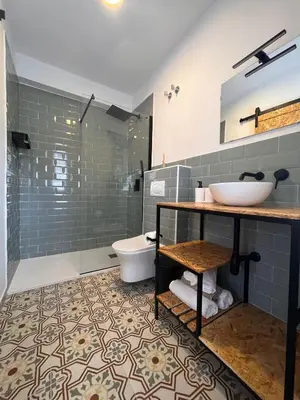 a bathroom with a sink and a toilet at Apartamentos Ribadeo in Ribadeo