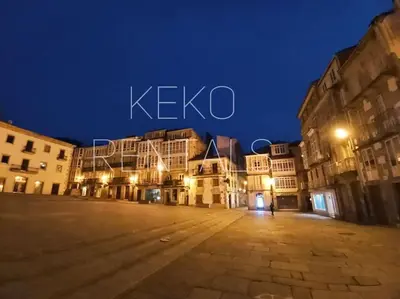 an empty street in a city at night at Casa Lolita 2 in Viveiro