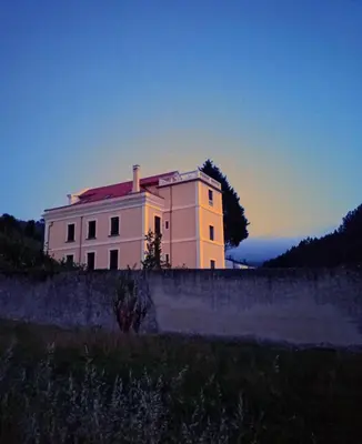 a white house sitting on top of a field at Santa Emilia in Mondoñedo