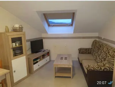 a living room with a couch and a tv at CANTABRICO in Barreiros