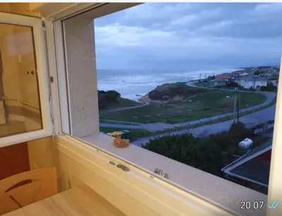 a window with a view of the ocean at CANTABRICO in Barreiros