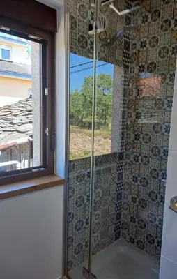 a shower in a bathroom with a window at CASA ARABIA in Monforte de Lemos