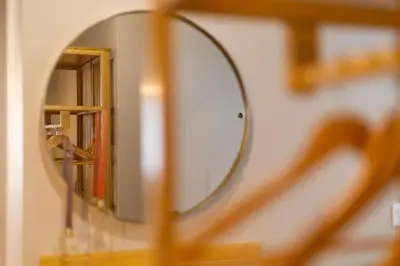 a mirror on a shelf in a bathroom at Apartamentos Gurugú in Ribadeo