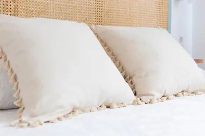 two pillows sitting on top of a bed at Apartamentos Gurugú in Ribadeo