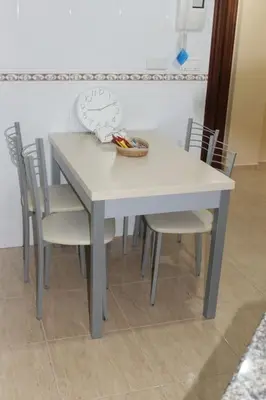 a kitchen with a sink and a counter top at Apartamentos Camino Inglés in Ordes