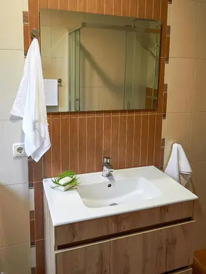 a bathroom with a sink and a mirror at Casa Río Samo in Garabanja