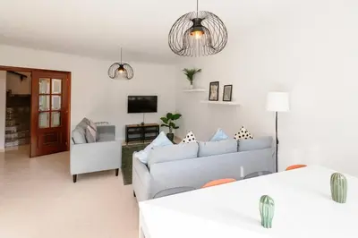 a living room with a couch and a tv at Casa Bella Lalin- 4 Double bedroom Galician Country Home! in Pontevedra