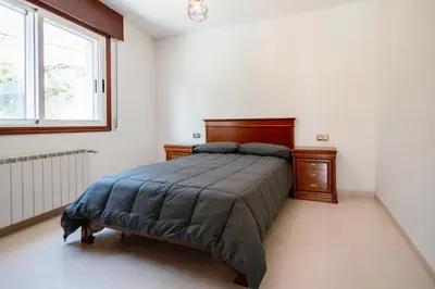 a bedroom with a large bed and a window at Casa Bella Lalin- 4 Double bedroom Galician Country Home! in Pontevedra