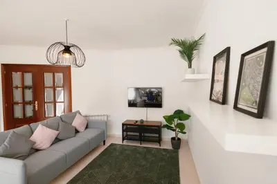 a living room with a couch and a table at Casa Bella Lalin- 4 Double bedroom Galician Country Home! in Pontevedra