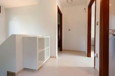 a white cabinet in the middle of a hallway at Casa Bella Lalin- 4 Double bedroom Galician Country Home! in Pontevedra