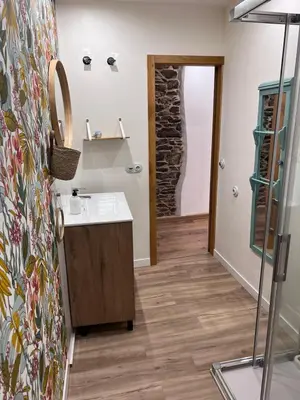 a bathroom with a sink and a mirror at El Rincón del Val in Priaranza del Bierzo