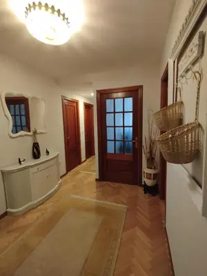 a living room with a door and a chandelier at PISO MANCE in Allariz