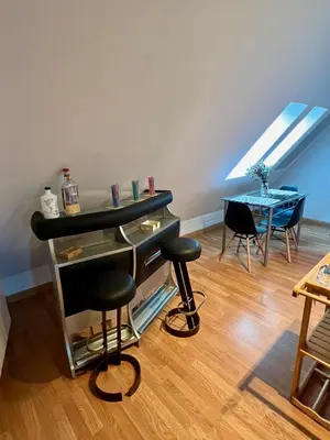 a room with a piano and a table and chairs at Ático Camino Santiago: El Comienzo Perfecto in Sarria