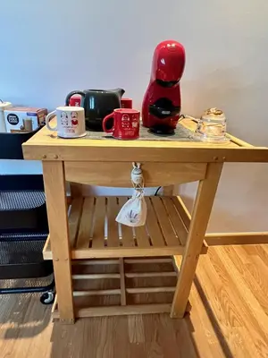 a wooden table with a tea pot and cups on it at Ático Camino Santiago: El Comienzo Perfecto in Sarria
