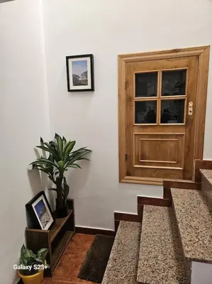 a room with stairs and a door and a potted plant at Casa Lina VUT OR 000784 in Allariz