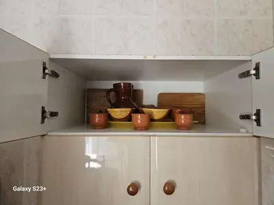 a cupboard with bowls and utensils in a kitchen at Casa Lina VUT OR 000784 in Allariz