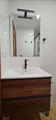 a bathroom with a sink and a mirror at Estudio céntrico con terraza in Xinzo de Limia