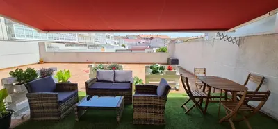 a patio with chairs and a table and a table and chairs at Estudio céntrico con terraza in Xinzo de Limia