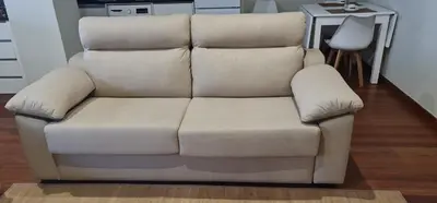 a tan couch sitting in a living room at Estudio céntrico con terraza in Xinzo de Limia