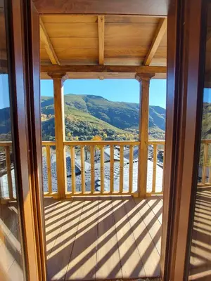 a view from the balcony of a cabin with a view at Lar da cima in Folgoso