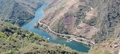 an aerial view of a river between two mountains at Ás Portas do Sil - En la Ribeira Sacra in Villar de Cerreda