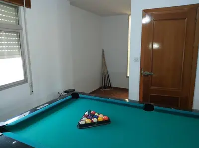 a pool table with a tray of balls on it at Casa Ricardo (16km de Coruña) in Castro