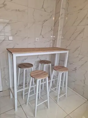 a white counter with three stools under it at Casa Ricardo (16km de Coruña) in Castro