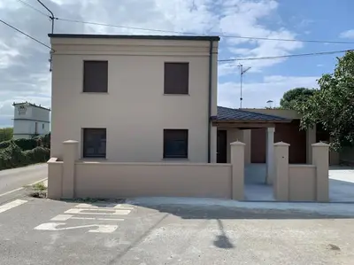 a white house sitting on the side of a street at A de Féliz Ribadeo in Ribadeo