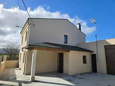 a white house with a roof on top of it at A de Féliz Ribadeo in Ribadeo