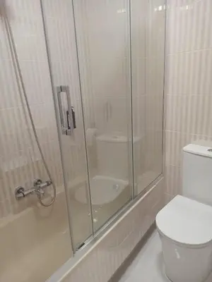 a bathroom with a shower with a toilet and a sink at Casa andaina in Palas de Rei