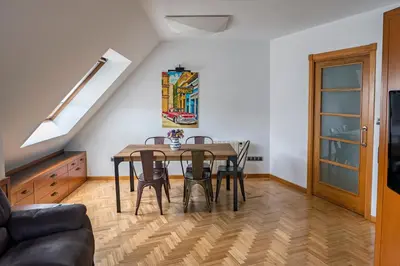 a dining room with a table and chairs at Ático en Sada in Sada