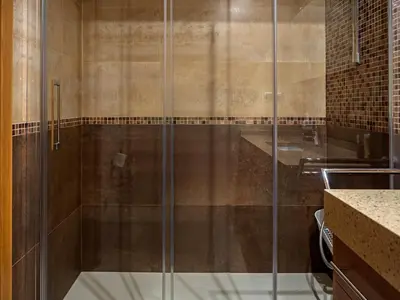 a shower with a glass door in a bathroom at Ático en Sada in Sada