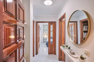 a hallway with two sinks and a mirror at Peregrina Pensión 5 in O Pedrouzo
