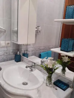 a bathroom with a white sink and a mirror at Campo da Torre in Caldas de Reis