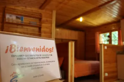 a sign that says ibenopolos in a room at Cabañas de Madera Sanabria in Vigo de Sanabria