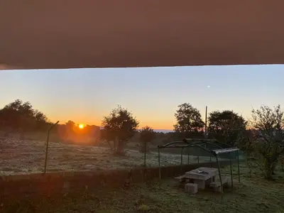 a playground with the sunset in the background at “Casa abella “ in Monterrei
