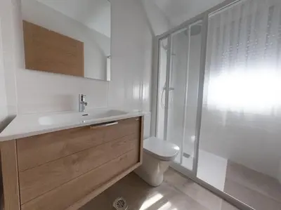 a bathroom with a toilet and a sink and a shower at PENSION BOUTIQUE TEIXEIRA, 3 ESTRELLAS in La Teijeira