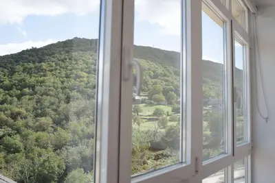 an open window with a view of a mountain at PENSION BOUTIQUE TEIXEIRA, 3 ESTRELLAS in La Teijeira
