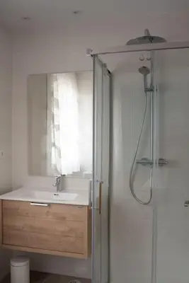 a bathroom with a sink and a shower at PENSION BOUTIQUE TEIXEIRA, 3 ESTRELLAS in La Teijeira