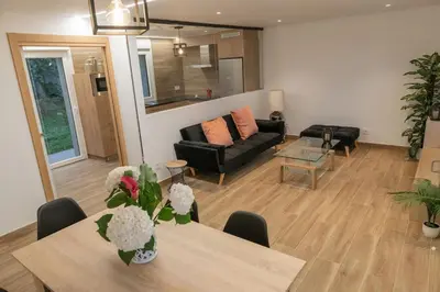 a living room with a table and a couch at Casa Tía Pepa in Castenda