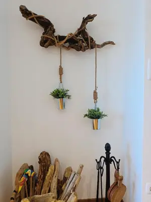 a room with two hanging plants on a wall at Penthouse Panorámico in Viveiro