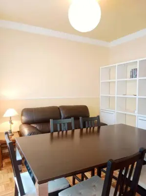 a living room with a table and a couch at Pastor Diaz Home in Viveiro